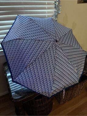 Christian Dior 
Vintage 90,s
Trotter Folding Umbrella
Wood Handle